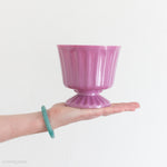 pink footed plastic vase